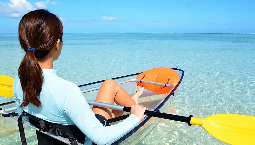 Kayaking in the Semporna Islands near an overwater resort