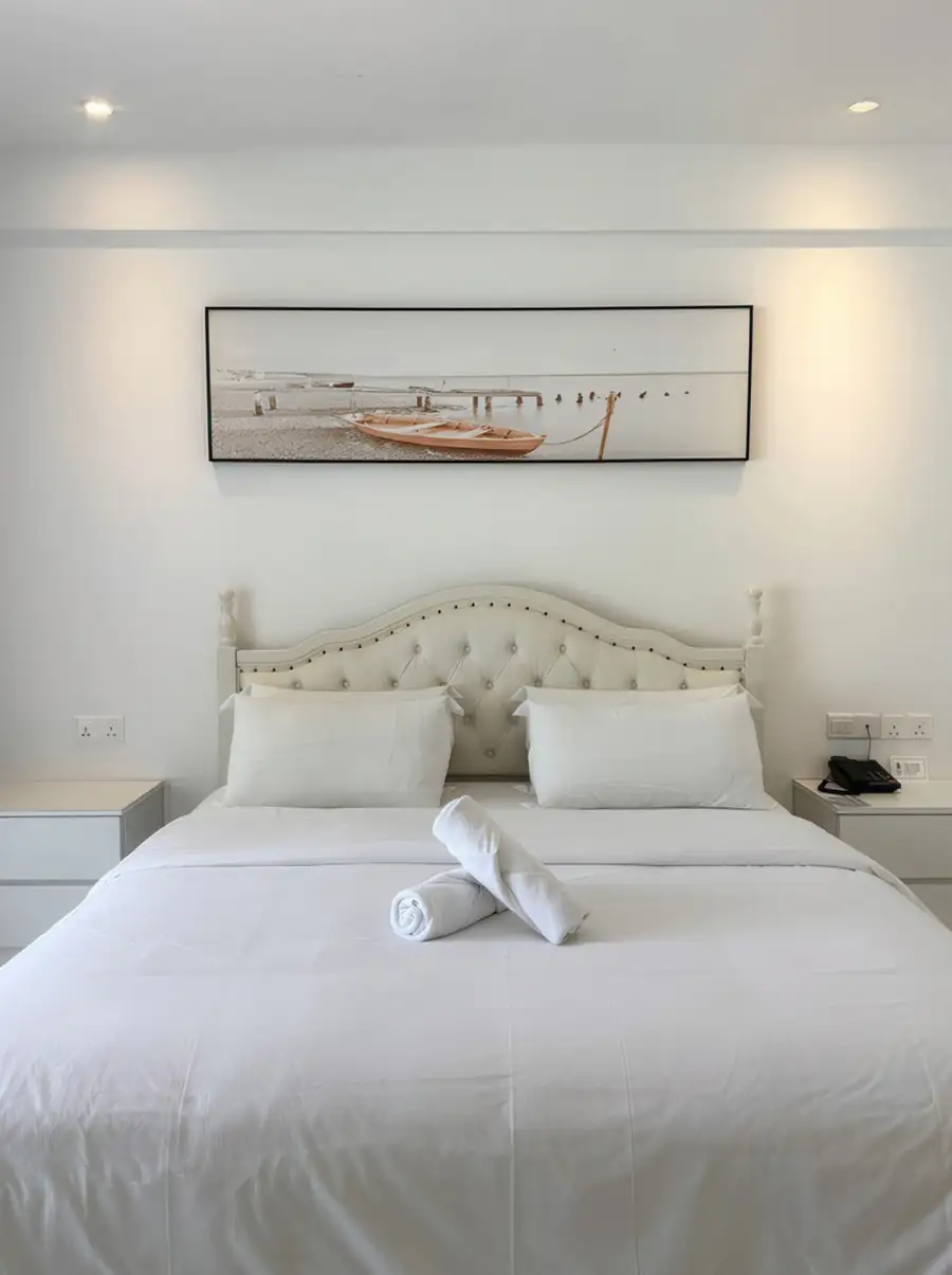 King bed with towel art in Standard Garden Room