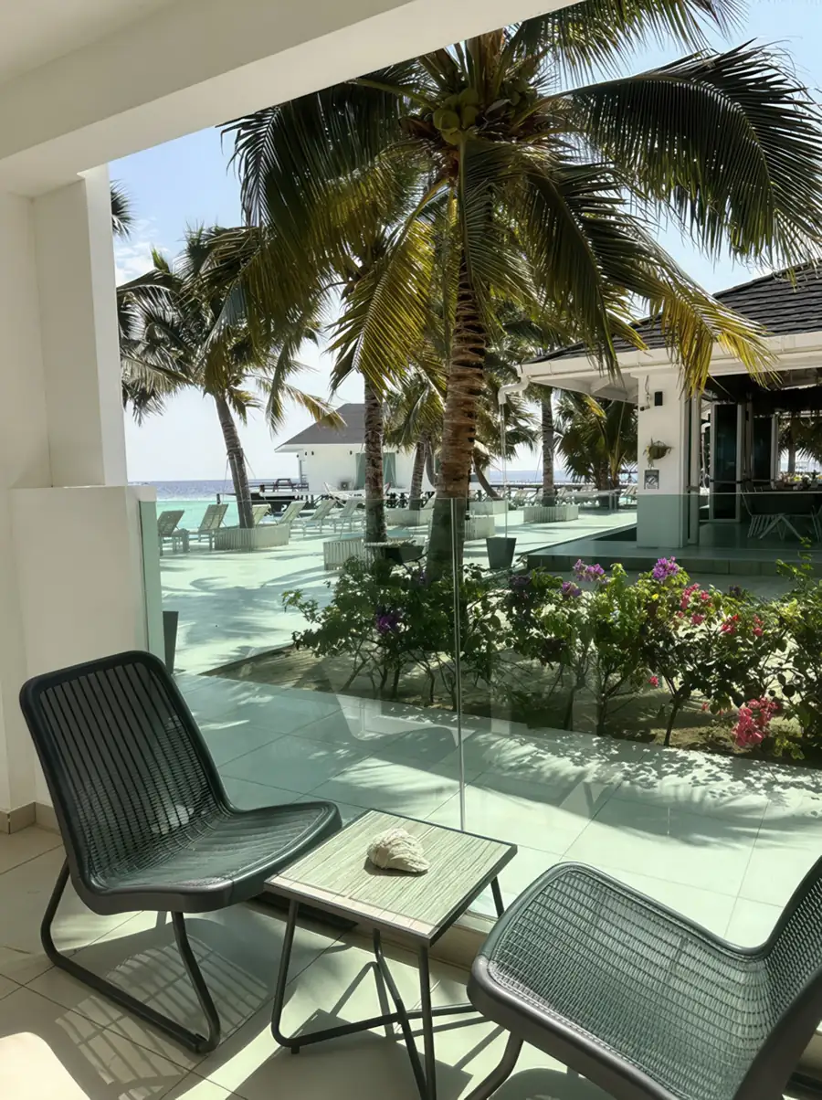 Garden balcony with lush greenery at Arcadia Beach Resort