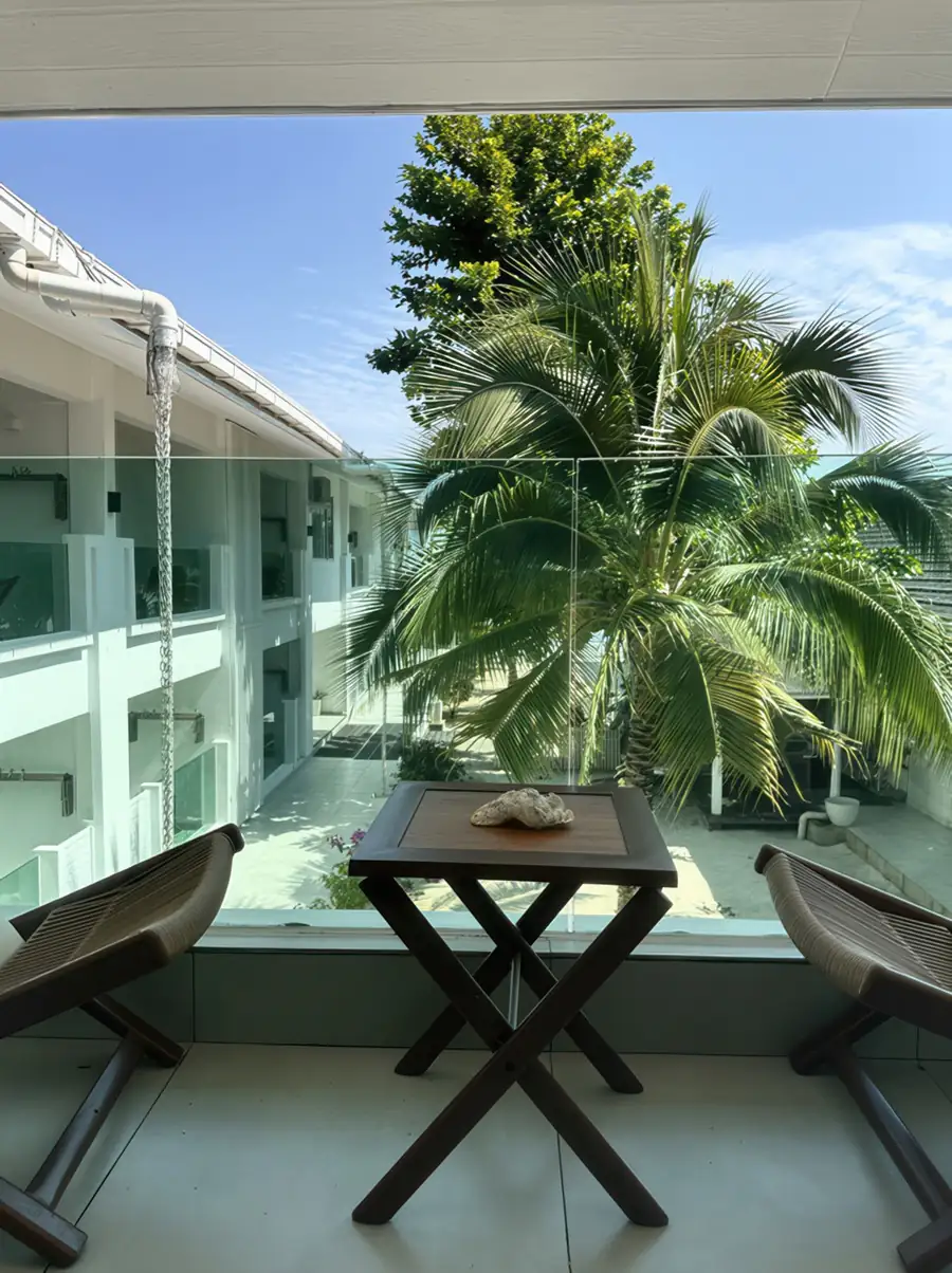 Outdoor deck overlooking garden at Arcadia Beach Resort